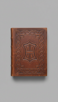 Antique leather-bound ledger with embossed cover